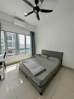 a bedroom with a bed and a ceiling fan at Rc Residences in Kuala Lumpur