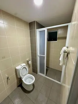 a bathroom with a toilet and a walk in shower at Rc Residences in Kuala Lumpur
