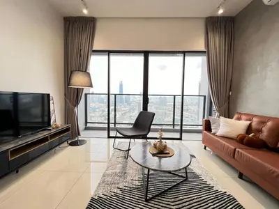 a living room with a couch and a tv at Trion klcc view apartment near TRX in Kuala Lumpur