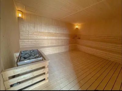 a large empty sauna with a wooden floor and wooden floors at Trion klcc view apartment near TRX in Kuala Lumpur