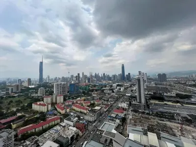 an aerial view of a city with tall buildings at Trion klcc view apartment near TRX in Kuala Lumpur