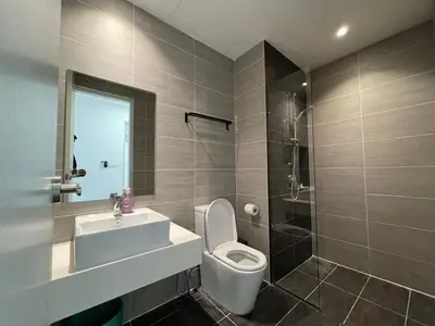 a bathroom with a toilet and a sink and a shower at Trion klcc view apartment near TRX in Kuala Lumpur