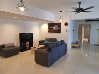 a living room with two couches and a flat screen tv at Fahrenheit, Stay in the Heart of KL, 15 pax in Kuala Lumpur