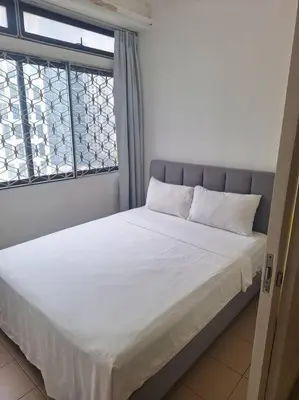 a bed in a room with a window at Fahrenheit, Stay in the Heart of KL, 15 pax in Kuala Lumpur