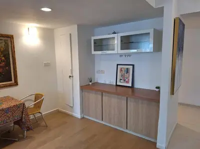 a kitchen with a counter and a table in a room at Fahrenheit, Stay in the Heart of KL, 15 pax in Kuala Lumpur