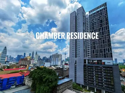 a city skyline with the words chamber residence on a building at Chamber Suite Klcc & KL Tower view in Kuala Lumpur