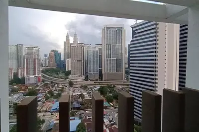 a view of a city skyline with tall buildings at COL 108B Modern KLCC Balcony View & Infinity Pool in Kuala Lumpur