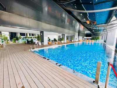 a large swimming pool in a large building at Mcity Ampang Duplex Groove in Kuala Lumpur