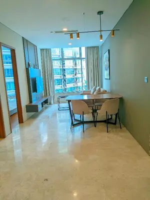 a dining room with a table and chairs at vortex Suites KLCC in Kuala Lumpur