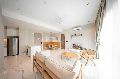 a living room with a couch and a table at Alfa Bangsar by Plush in Kuala Lumpur