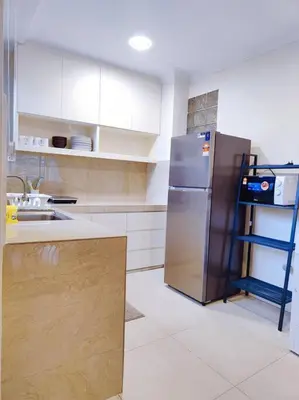 a kitchen with a stainless steel refrigerator and a shelf at Newly Reno Wisma Cosway Pavilion KLCC Bukit Bintang in Kuala Lumpur