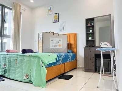 a bedroom with a bed and a table and a mirror at Cozy Kenwingston Platz KL 2-5 Pax2BR&2BR Pakin Netflix 1306 in Kuala Lumpur
