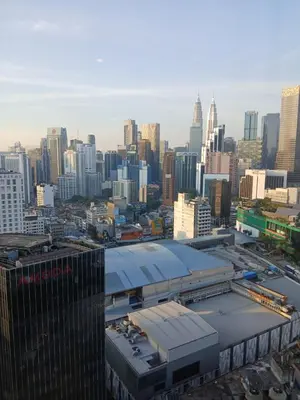 a view of a large city with a building at Family Empire Suites At Times Square in Kuala Lumpur