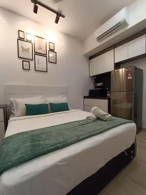 a bedroom with a large bed in a room at COL 171B KLCC Balcony View & Infinity Pool in Kuala Lumpur