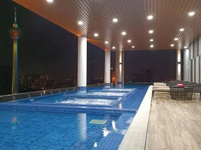a large swimming pool on the top of a building at COL 23a8A Morden KLCC View Studio in Kuala Lumpur