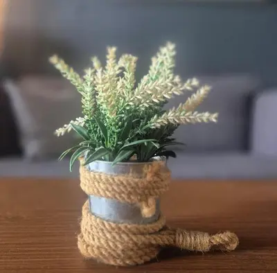 a plant in a crochet pot sitting on a table at 3 Towers Jalan Ampang KL in Kuala Lumpur