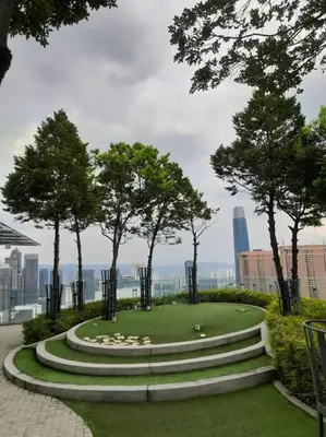 a park with stairs and trees on top of a building at Cozy Idaman Robertson Suite Balcony in Kuala Lumpur
