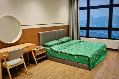 a room with a bed and a desk and a mirror at 4B3R Lux Penthouse Astoria Ampang in Kuala Lumpur