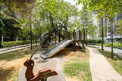 a playground in a park with a wooden slide at 4B3R Lux Penthouse Astoria Ampang in Kuala Lumpur