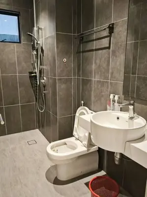 a bathroom with a toilet and a sink at 4B3R Lux Penthouse Astoria Ampang in Kuala Lumpur