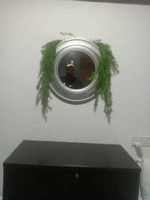 a man is taking a picture in a mirror at STAY WITH DAy CAUCON in Kuala Lumpur