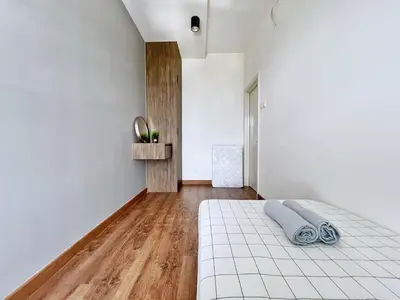 a bedroom with white walls and a bed in a room at Arte Mont Kiara Wonder 2BR Suites in Kuala Lumpur