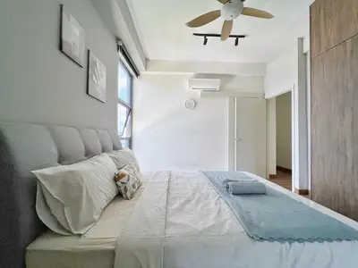a bedroom with a bed with a ceiling fan at Arte Mont Kiara Wonder 2BR Suites in Kuala Lumpur