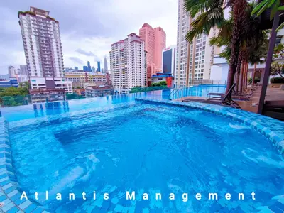 a large swimming pool in the middle of a city at Kuala Lumpur, KLCC View, Titiwangsa, Tr Resident,Near MRT Station, 3BR 2BH by Atlantis Management in Kuala Lumpur