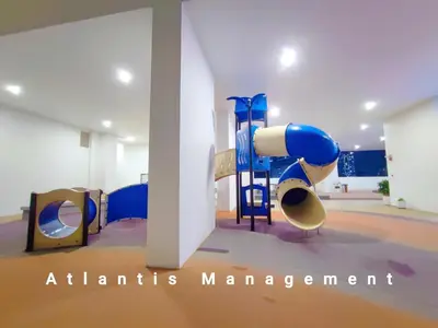 a childrens playground with a blue slide in a room at Kuala Lumpur, KLCC View, Titiwangsa, Tr Resident,Near MRT Station, 3BR 2BH by Atlantis Management in Kuala Lumpur