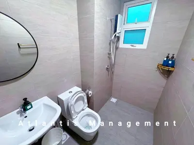 a bathroom with a white toilet and a sink at TR Residence Block A,Titiwangsa in Kuala Lumpur