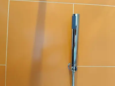 a close up of a metal door in a bathroom at Fahrenheit 88 in Kuala Lumpur