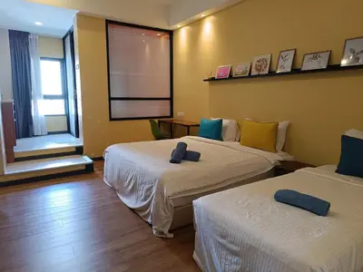 a hotel room with two beds and a window at Fahrenheit 88 in Kuala Lumpur