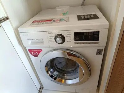 a washer and dryer in a small room at Fahrenheit 88 in Kuala Lumpur
