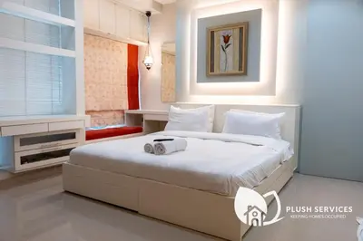 a bedroom with a large white bed in it at Parkview KLCC, Bukit Bintang in Kuala Lumpur