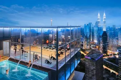 a view of a building with people in a pool at CORE TRX Suites in Kuala Lumpur