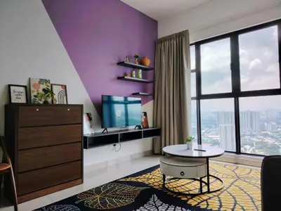 a living room with a table and a large window at Trion Residence Kuala Lumpur by Luxe in Kuala Lumpur