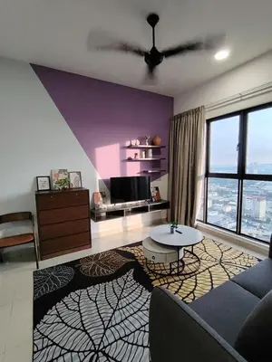 a living room with a couch and a tv at Trion Residence Kuala Lumpur by Luxe in Kuala Lumpur