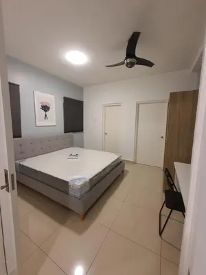 a bedroom with a bed and a ceiling fan at Maxim Citylights Sentul in Kuala Lumpur