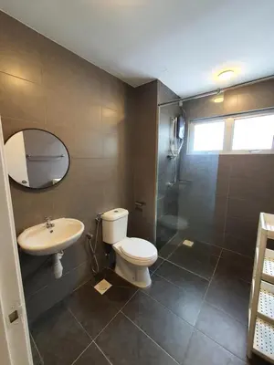 a bathroom with a toilet and a sink and a shower at Maxim Citylights Sentul in Kuala Lumpur