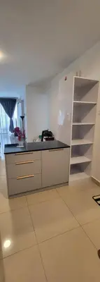 a kitchen with a counter and a sink and a shelf at Maxim Citylights Sentul in Kuala Lumpur