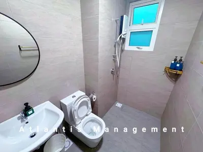 a bathroom with a white toilet and a sink at TR Residence Cozy & Luxury Apartment, Walking Distance MRT Titiwangsa & Nearby Titiwangsa Lake Garden in Kuala Lumpur