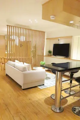 a living room with a white couch and a table at 1Min Pavilion Bukit Bintang KLCC Wisma Cosway in Kuala Lumpur