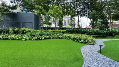a garden with green grass and a walkway at The Atrium Ampang KLCC City , 55000Jalan Ampang Hilir, Taman U Thant KLCC in Kuala Lumpur