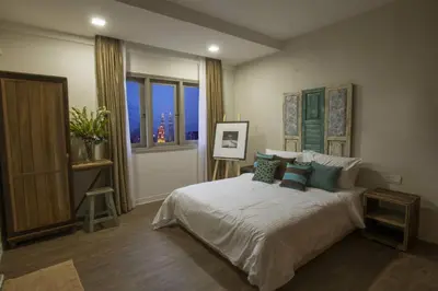 a bedroom with a large bed and a window at Redstone Boutique Hotel Kuala Lumpur in Kuala Lumpur