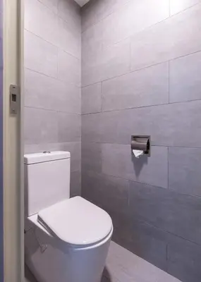 a bathroom with a white toilet in a room at Gaming World Suite In Arte Mont Kiara in Kuala Lumpur