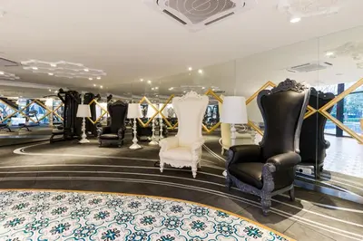 a dressing room with a lot of chairs and furniture at Gaming World Suite In Arte Mont Kiara in Kuala Lumpur