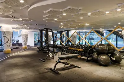 a gym with treadmills and weights in a building at Gaming World Suite In Arte Mont Kiara in Kuala Lumpur