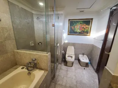 a bathroom with a shower and a toilet and a sink at KL BRB sarvice suite at time square in Kuala Lumpur