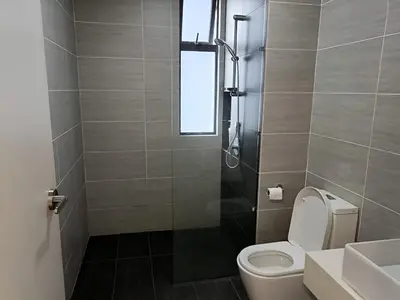 a bathroom with a toilet and a sink and a shower at Trion Kuala Lumpur by DSM in Kuala Lumpur