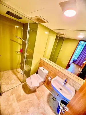 a bathroom with a toilet and a sink at Vortex Suites Klcc Area in Kuala Lumpur